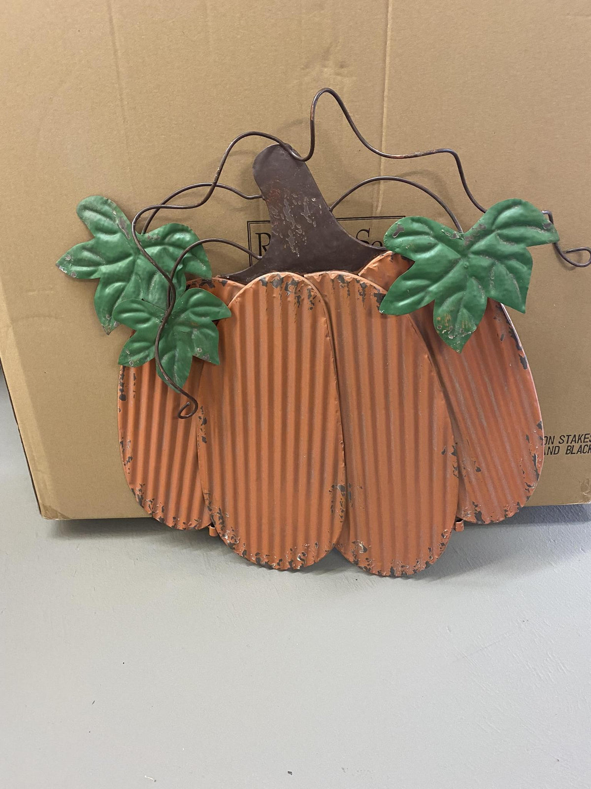 Orange pumpkin on Stake